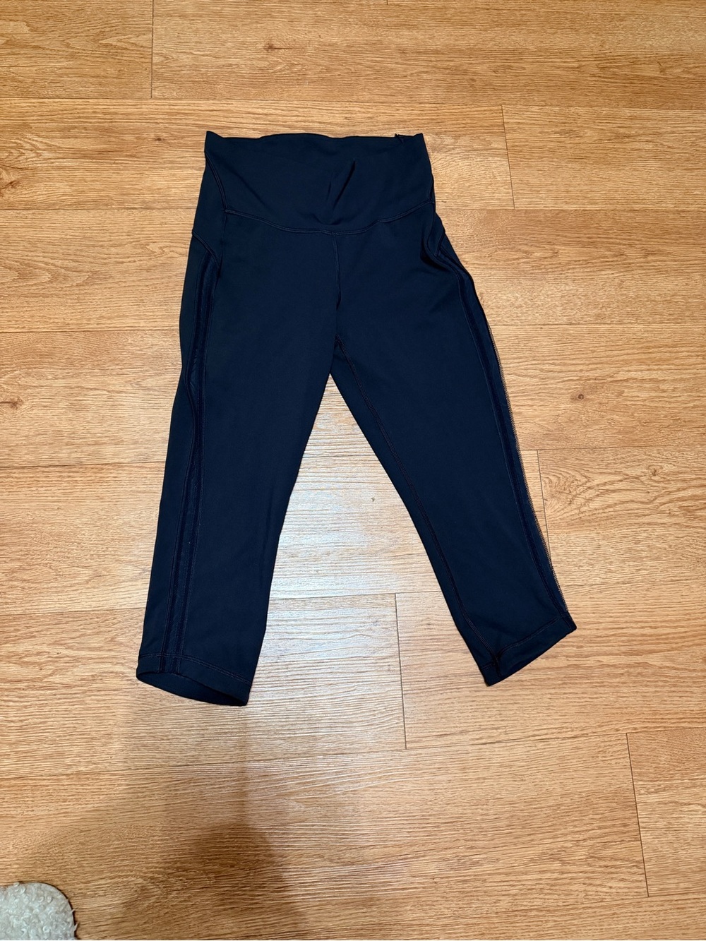 Lululemon black cropped leggings size 10 with mesh sides